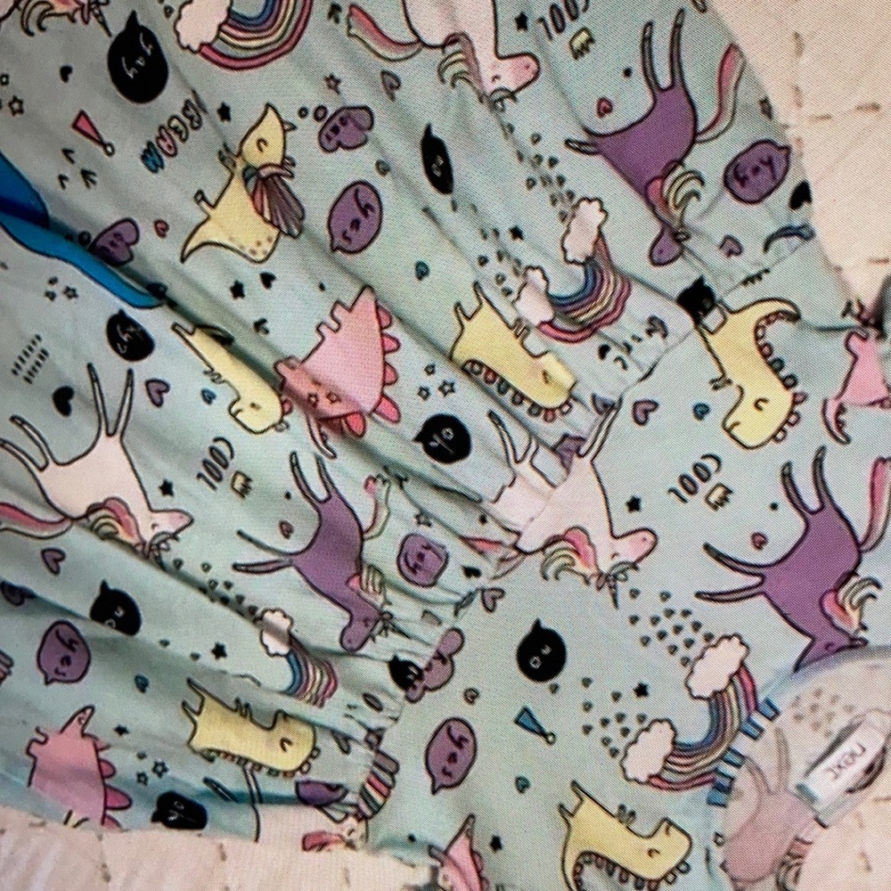 Pastel colors adorn fun casual blouse